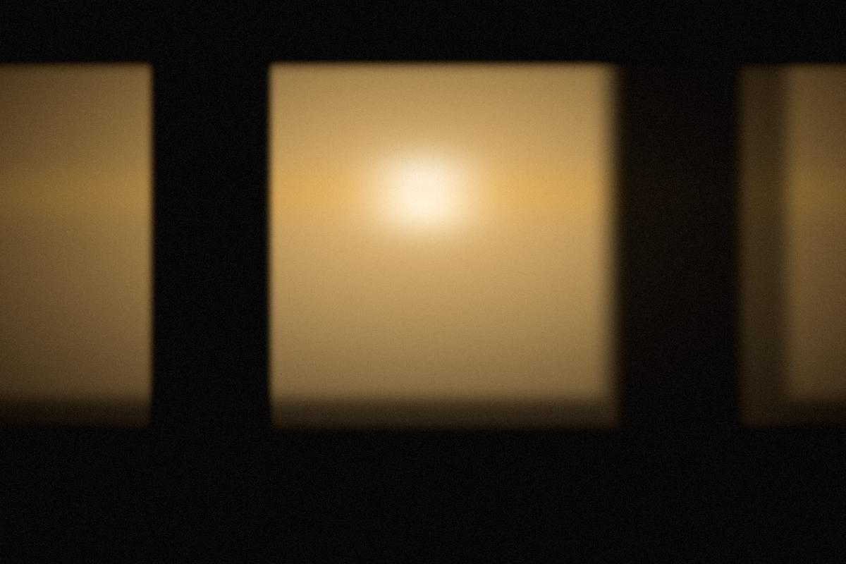 Stage light against the back wall of the hall.