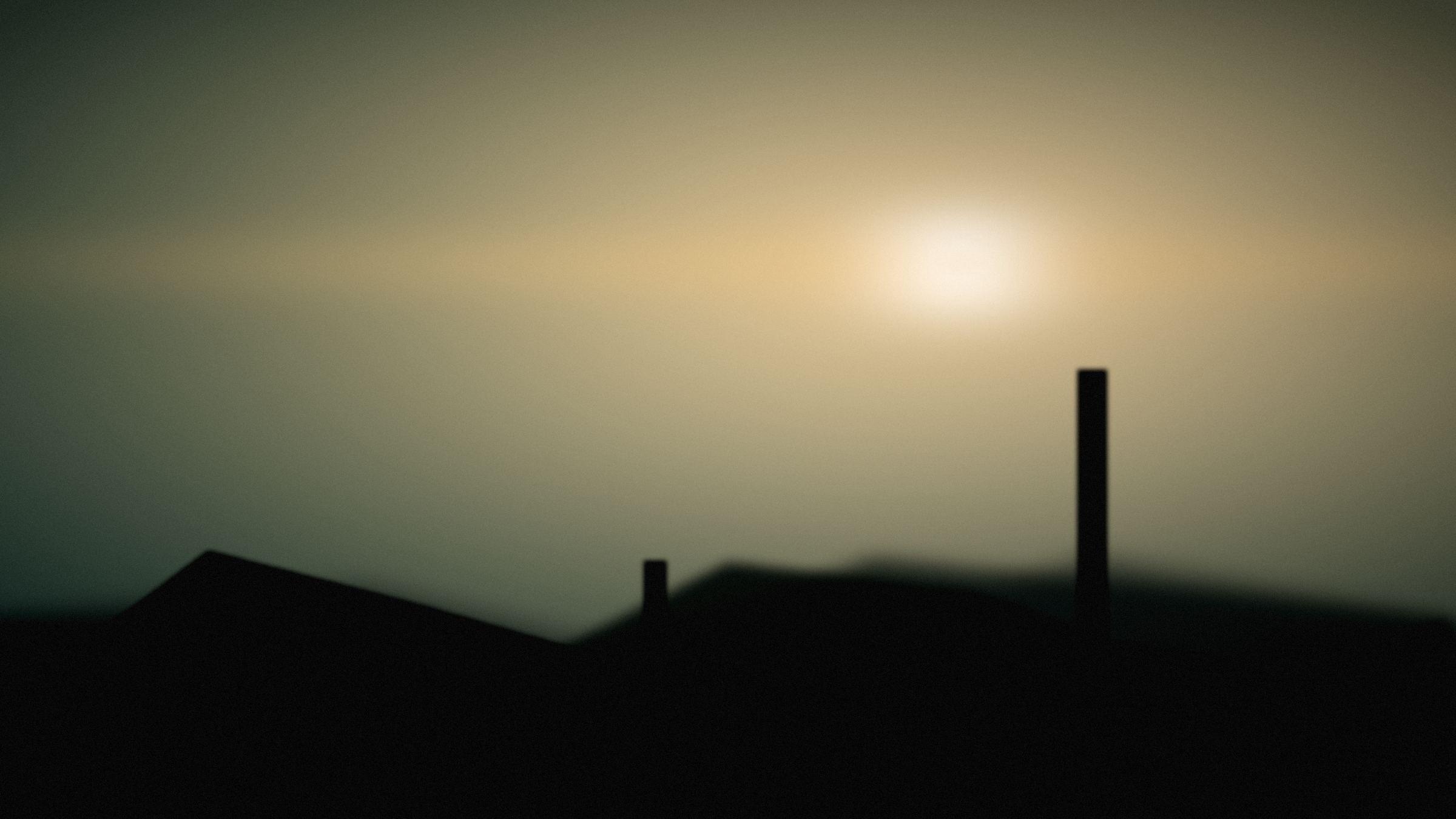 A low sun breaking over a ridge at the end of the day.