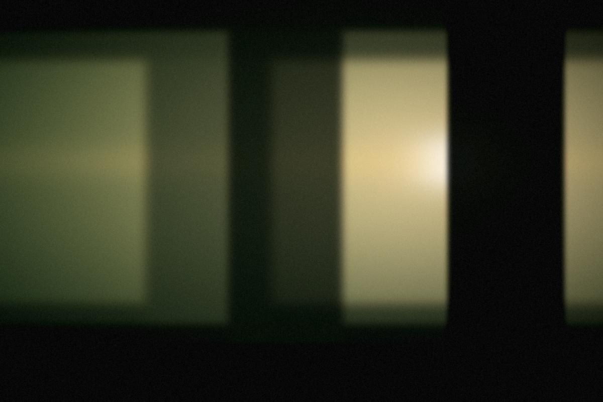 Warm window light inside the barn during preparations.