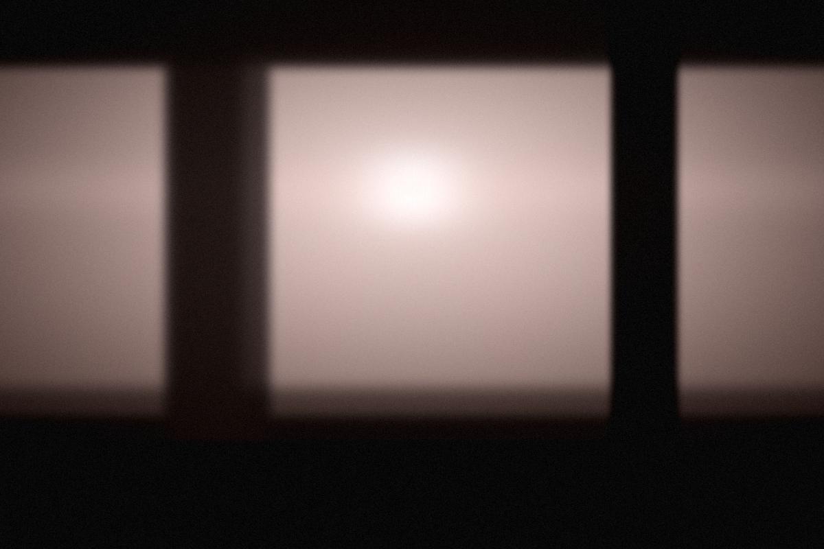 Soft light falling across a pale studio set.