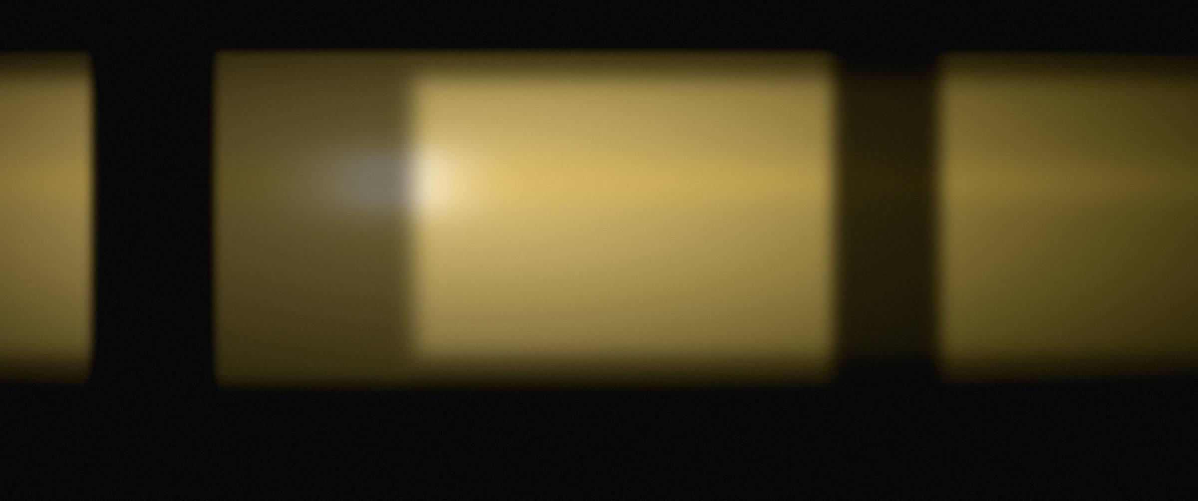 A workshop interior lit by a single warm lamp.