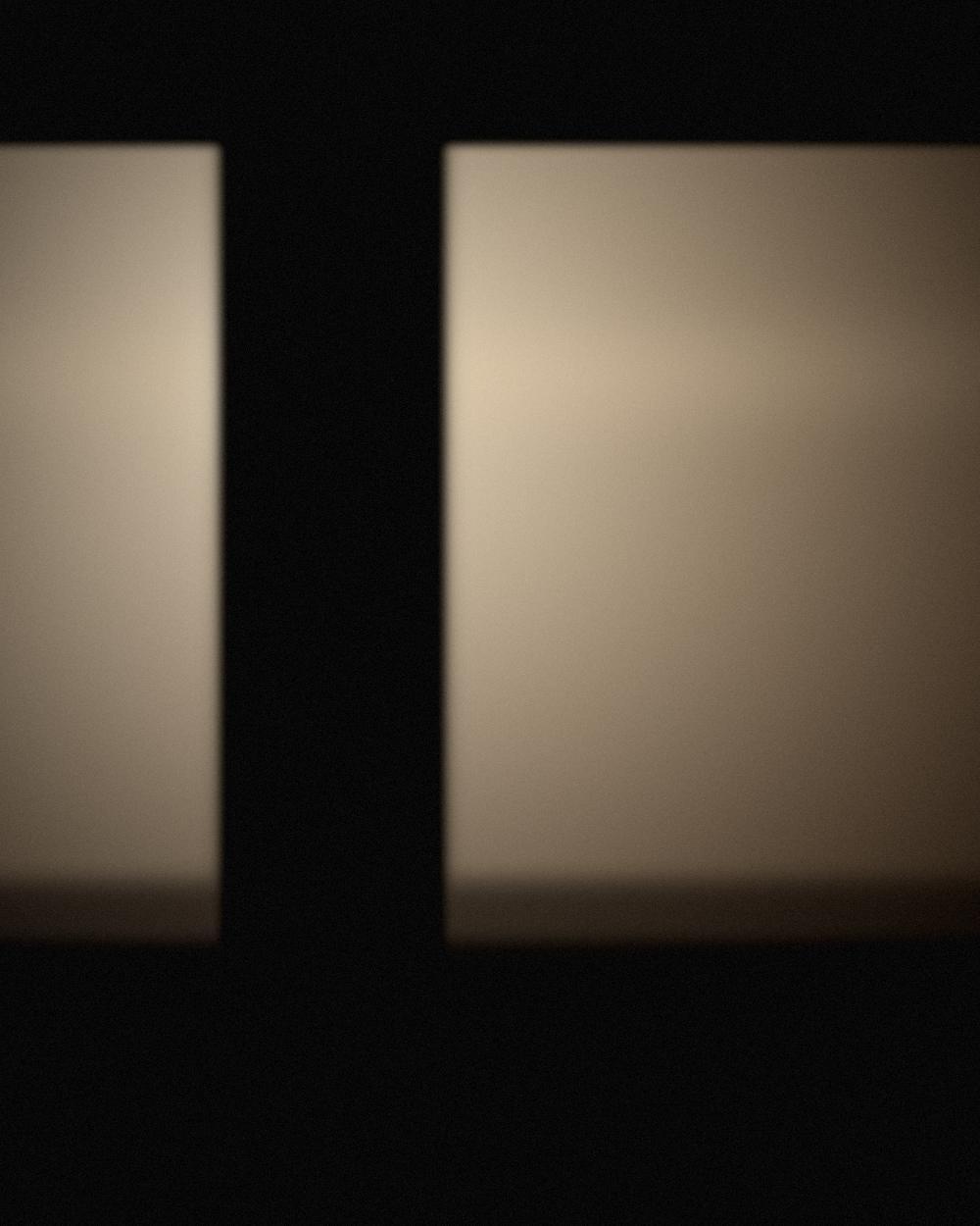 The filmmaker behind BJ Media at work, lit by a single window