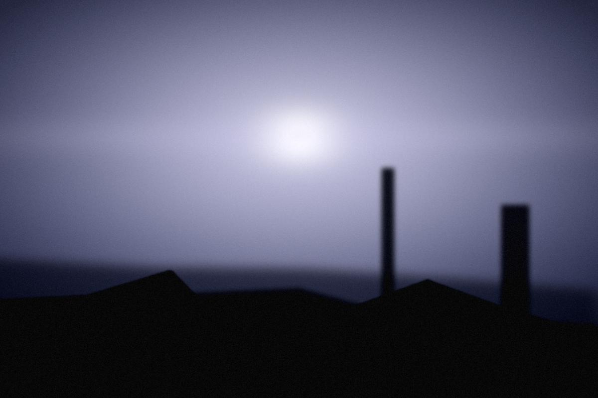 Streetlight against a dark road.